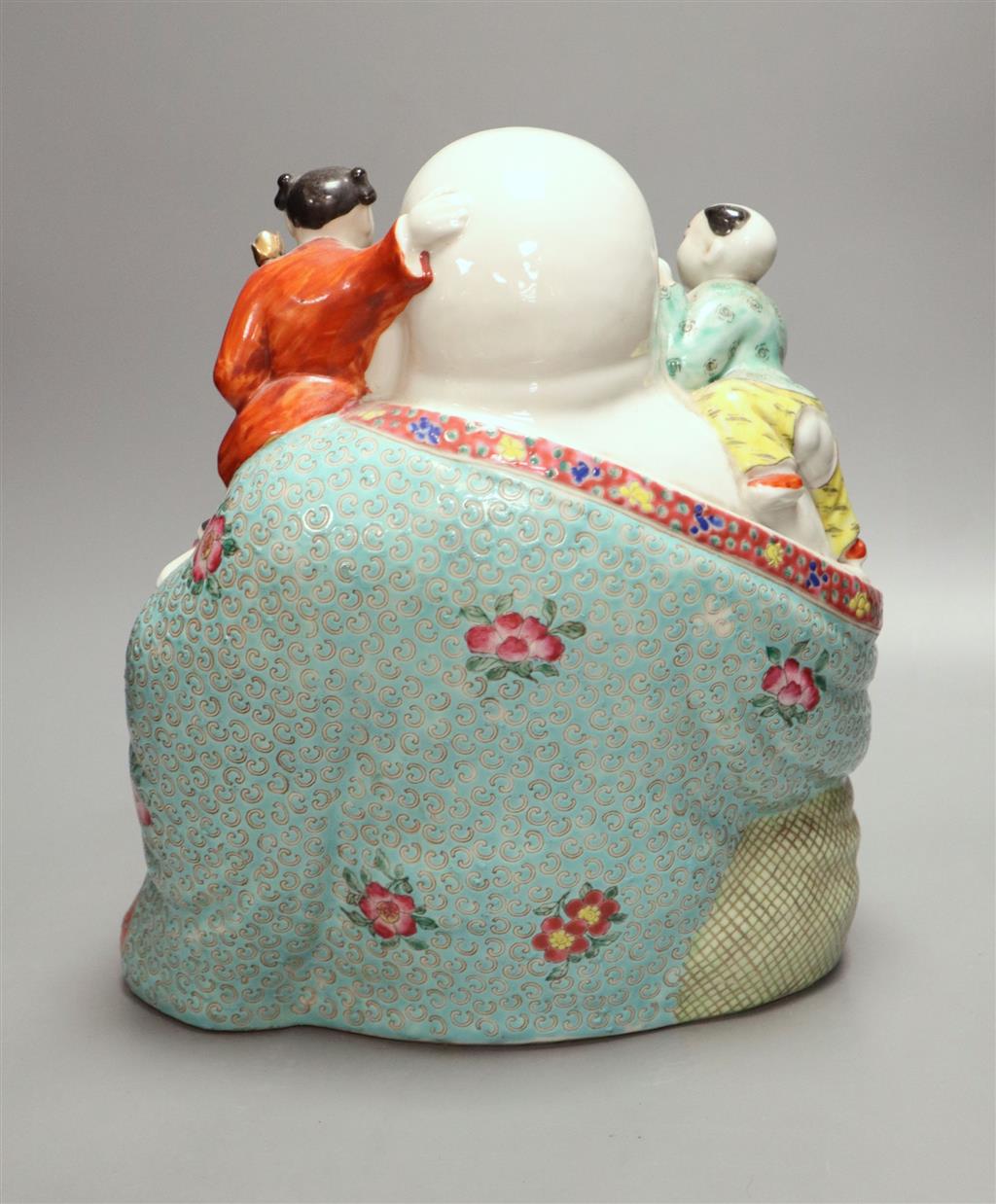 A large Chinese famille rose figure of Budai and children, mid 20th century, height 28cm